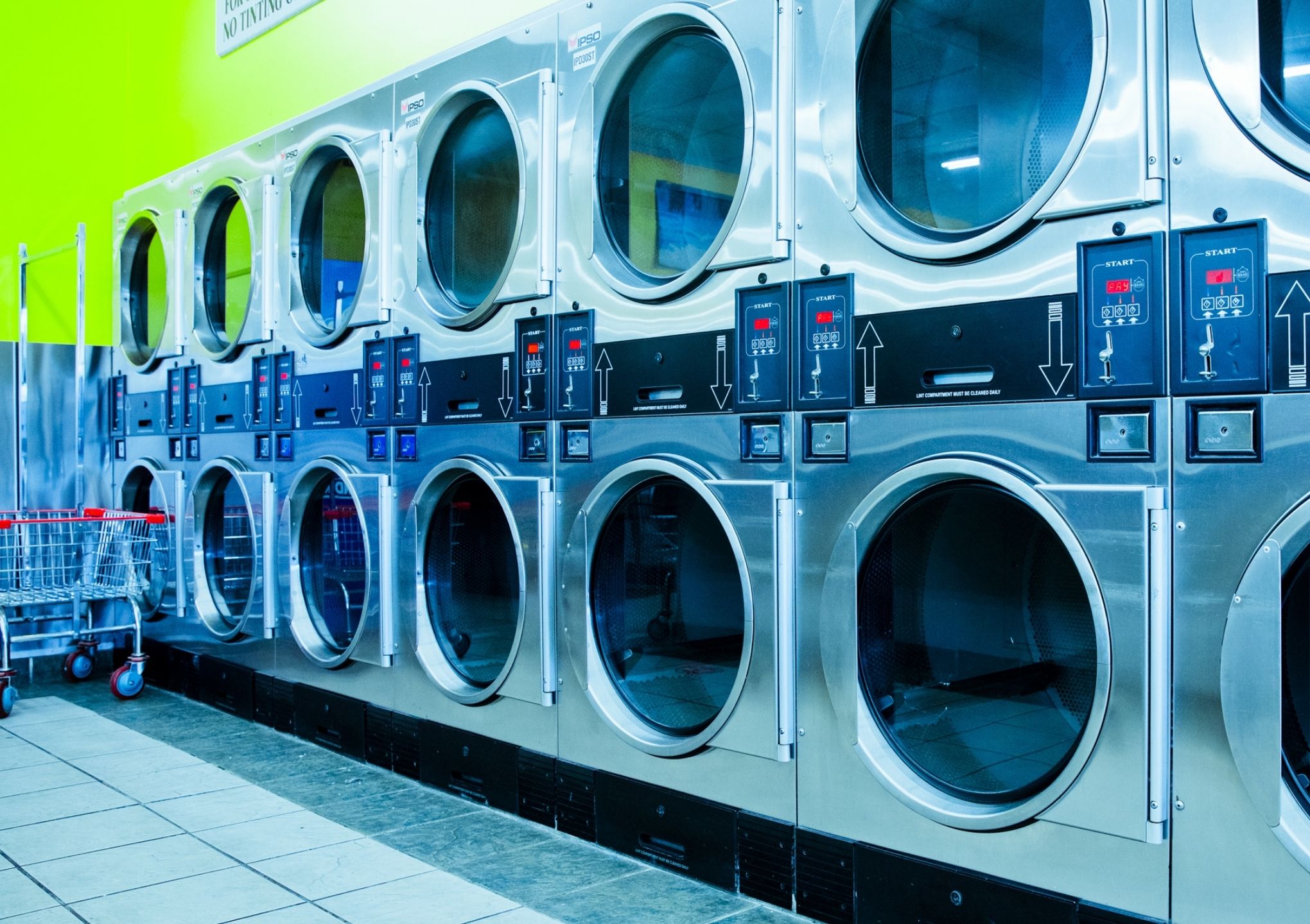 double stacked washing machine in coin laundry shop - Post Featured Image