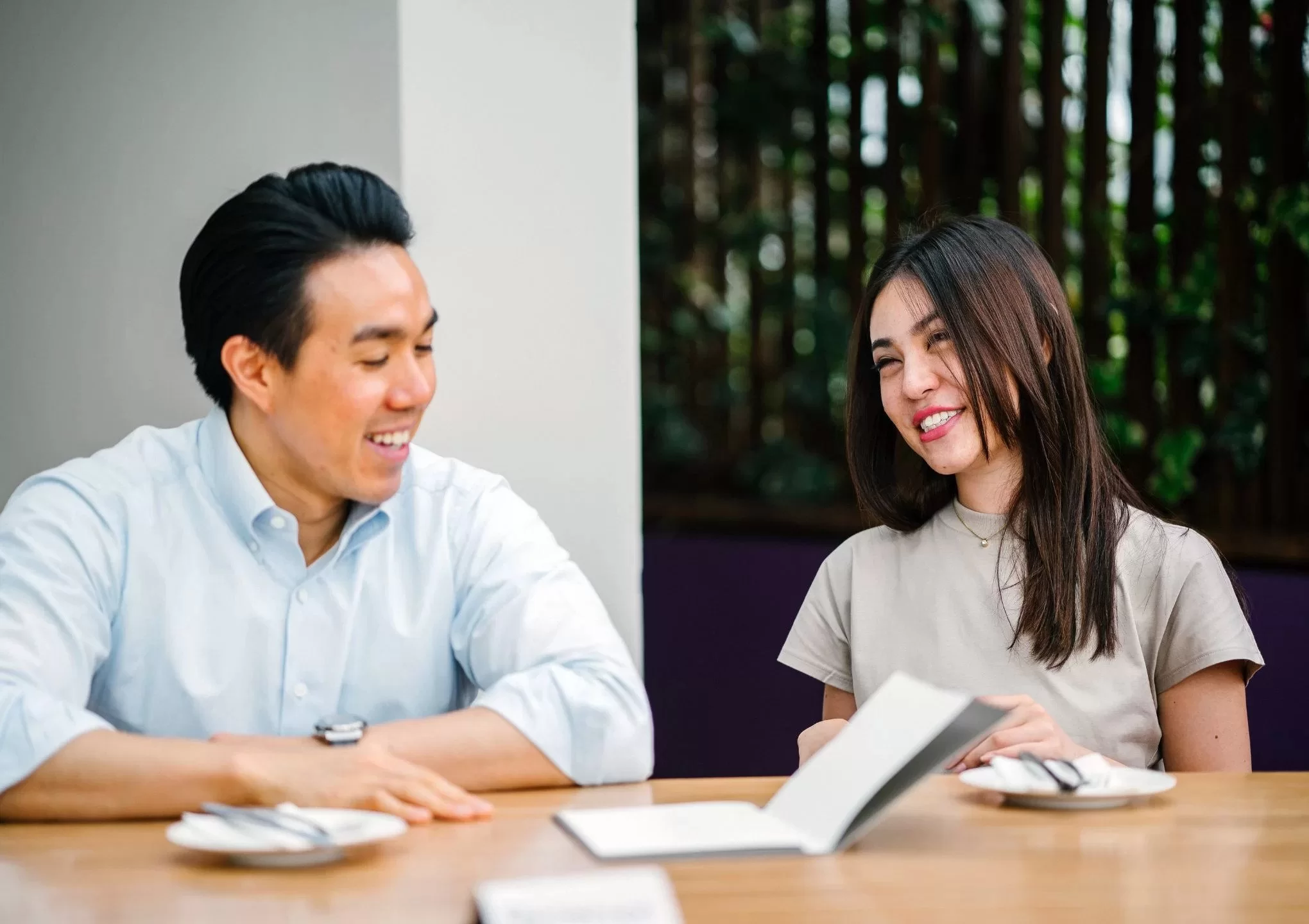 a-man-and-a-woman-are-discussing-on-the-table-post-featured-image