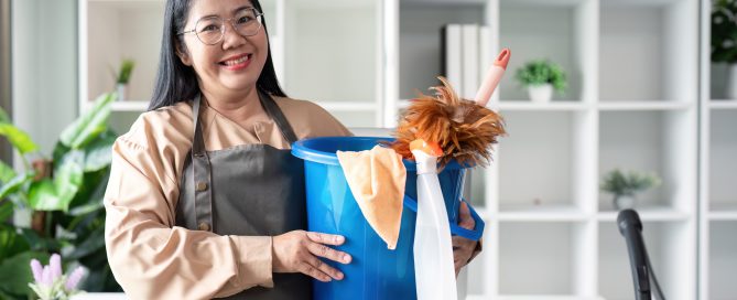 Housekeeper cleaning action modern home image of maid with bucket bright environment smiling viewpoint concept of cleanliness